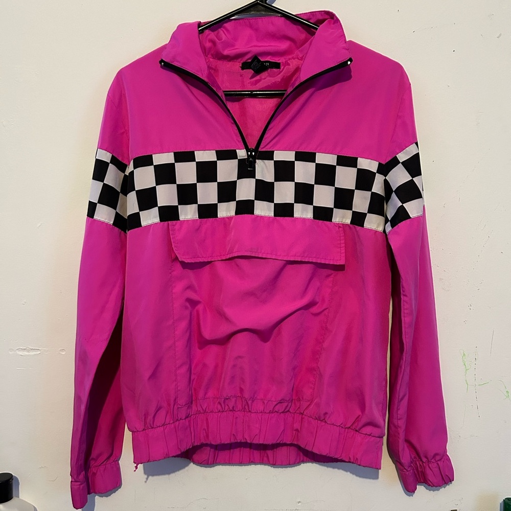 pink windbreaker with black and white checkered stripe